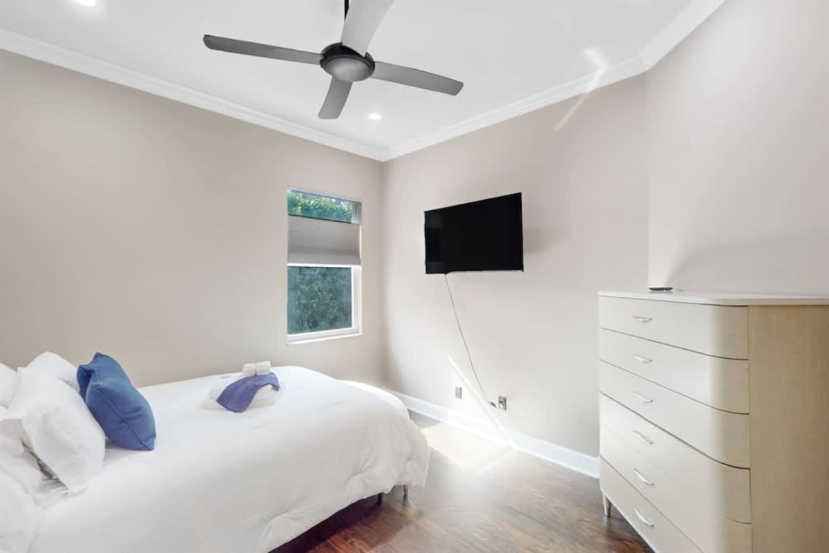 Clean, comfy bedroom w/ TV for laid-back evenings.