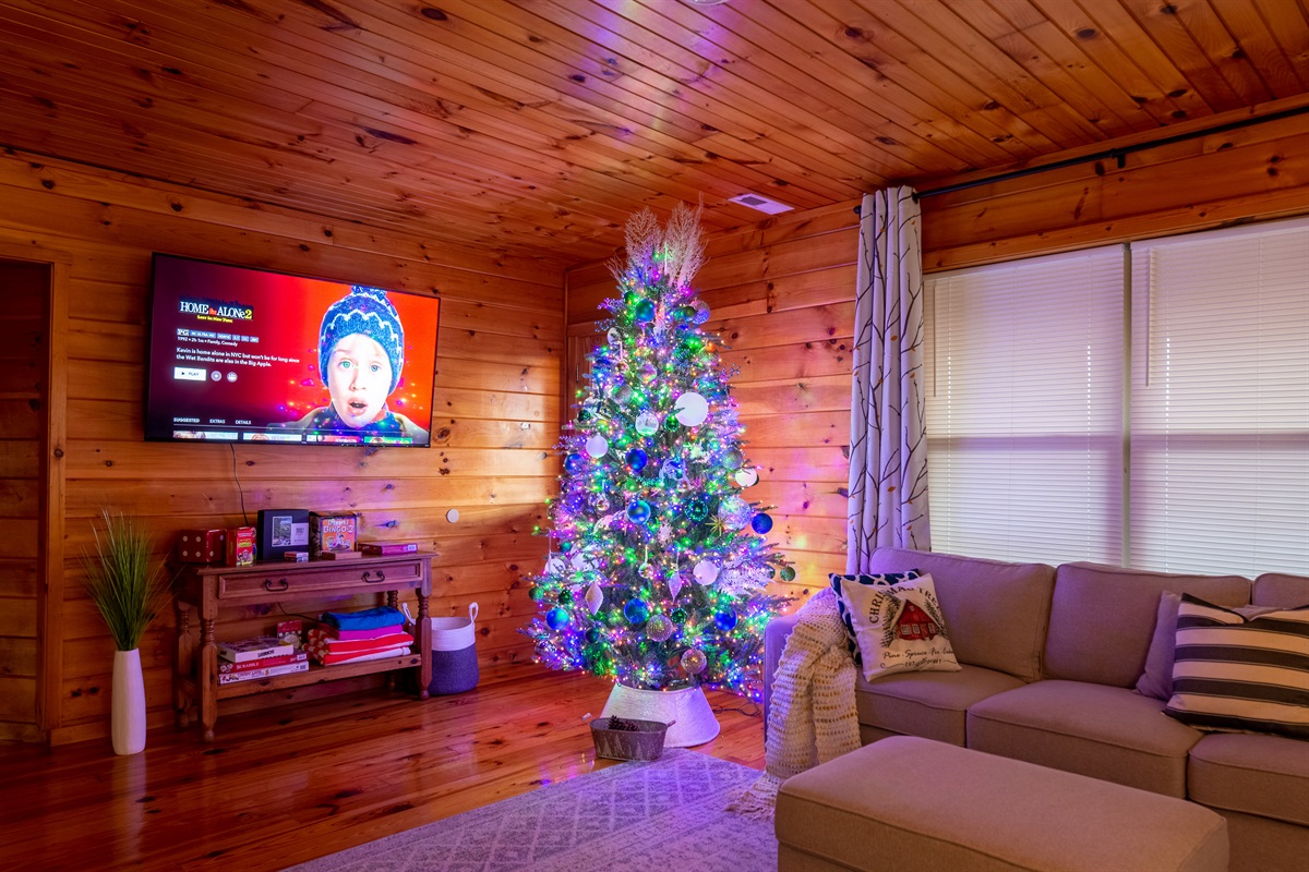 Cozy and warm in the loft: enjoy your favorite holiday movies on the 65" big screen TV.