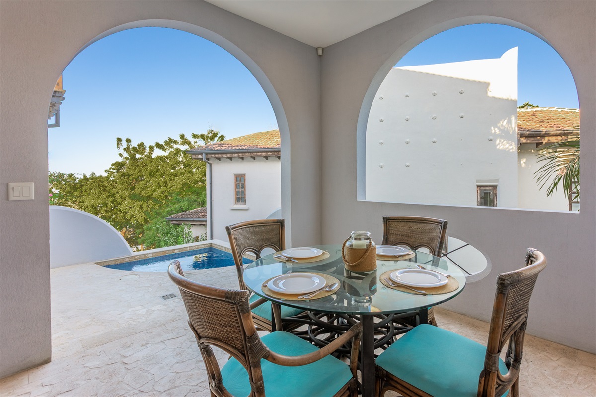 Covered outdoor dining with ocean views and plunge pool.