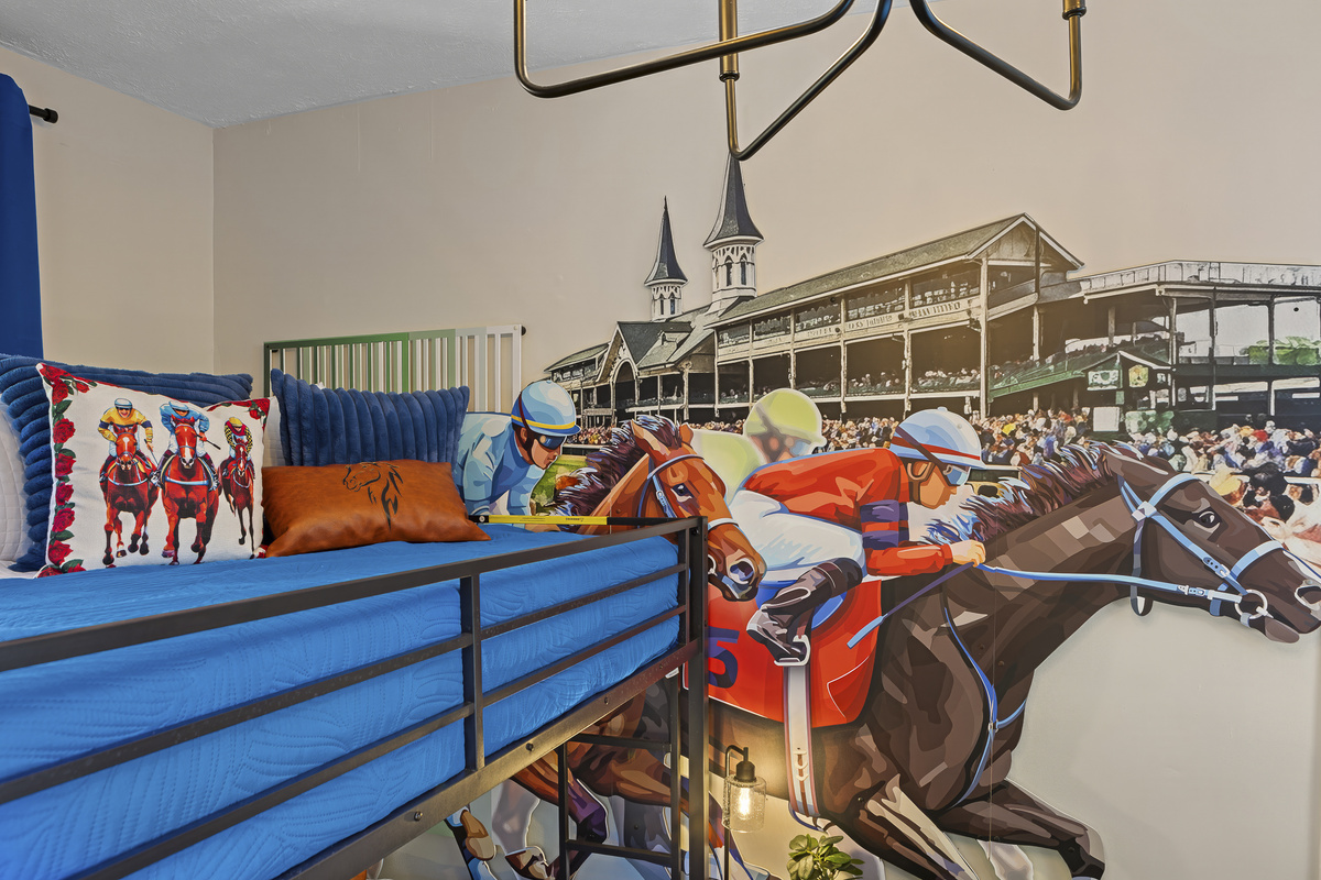 The jockeys charge toward the finish line. The best wall art in the house belongs to the Kentucky Derby Room.