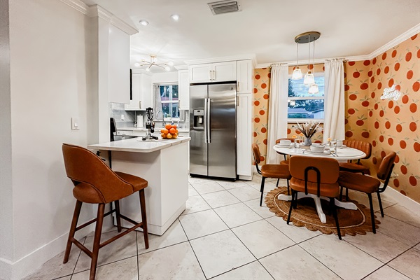 Kitchen with Refrigerator, Dishwasher, Oven, Microwave, Mini Bar, Utensils, Pots & Pans & Cookware. Dining Room with Comfortable Seating.
