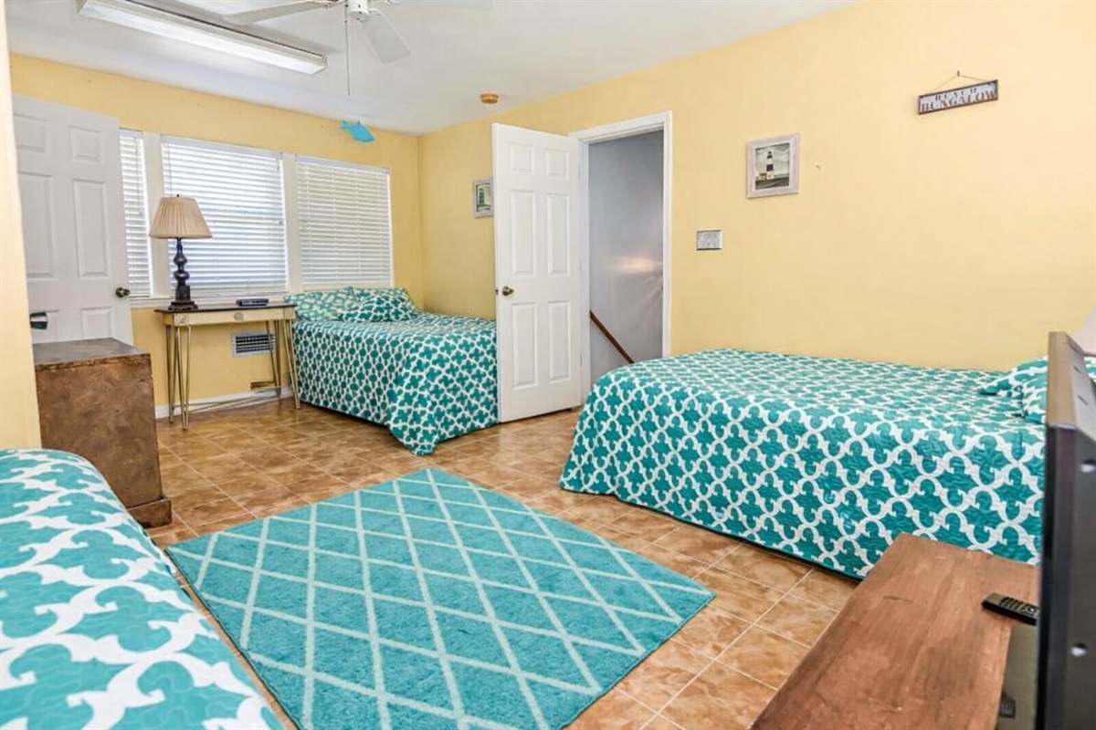 Triple Room (second floor) features 3 full beds perfect for a large family or friends