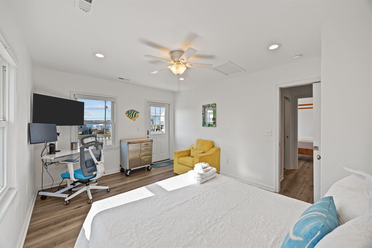 Dedicated desk setup with cozy seating, ideal for work or downtime