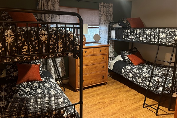 Bed 3: Two bunk beds, dimmable ceiling fan, blackout shades, tall dresser, closet, luggage rack, usb charger, door to 1/2 bath