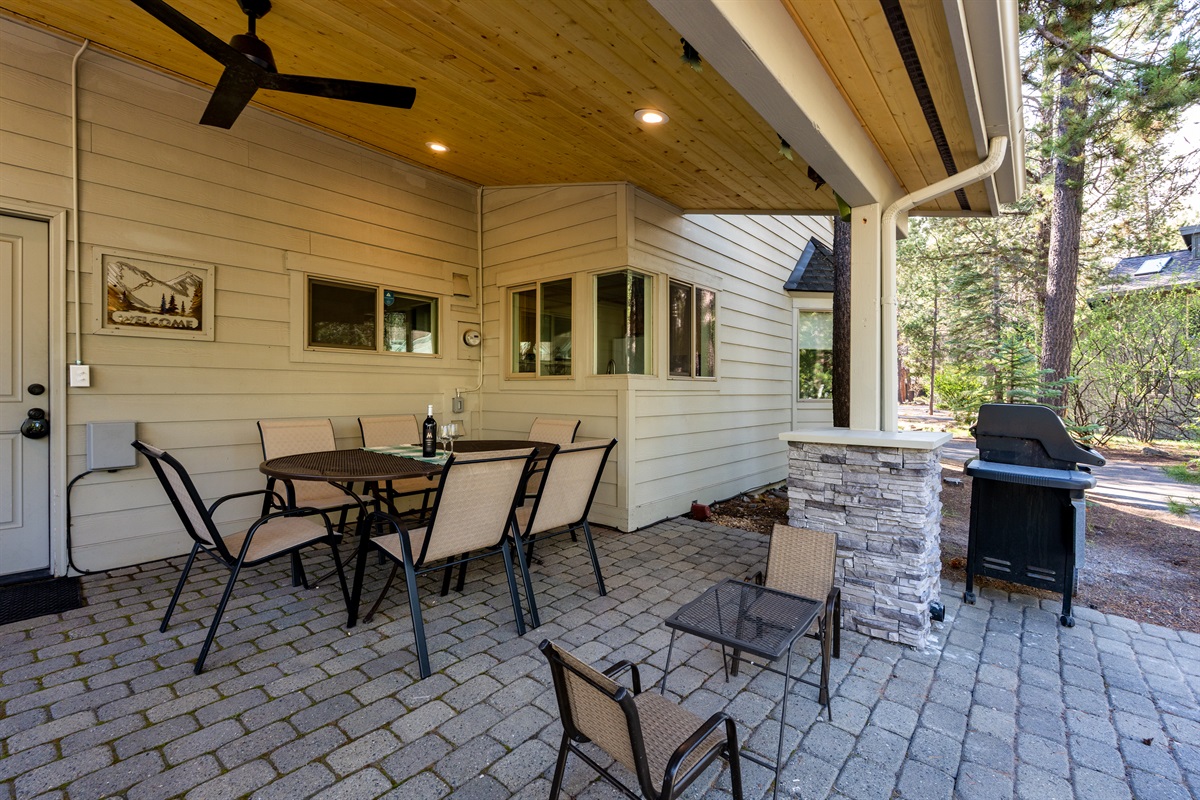 Enjoy a beautifully lit outdoor seating area designed for relaxed evenings, with an overhead fan to keep things cool and comfortable. Perfect setting to unwind, dine al fresco, or gather with family and friends, with a gas BBQ grill ready for meals.