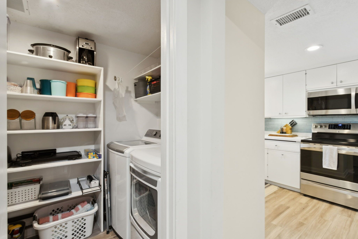 Full size LG Washer & Dryer-This is the laundry area and small appliance storage