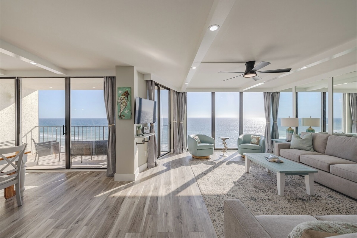 Living area and dining area both overlooking the water