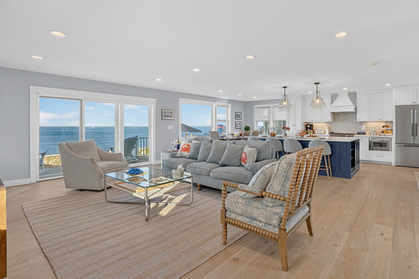 Bright open-concept living area with panoramic ocean views and seamless indoor-outdoor living