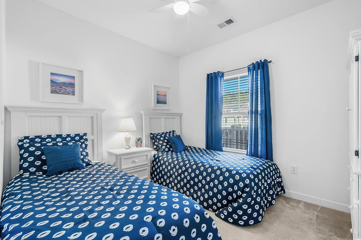 Lovely 2nd bedroom with twin beds, ceiling fan and TV