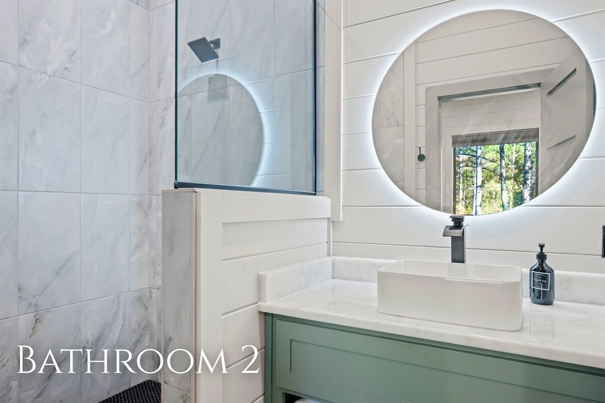 The bathrooms feature clean lines, stylish mirrors, and subtle touches that make even the simplest routines feel a little more special.