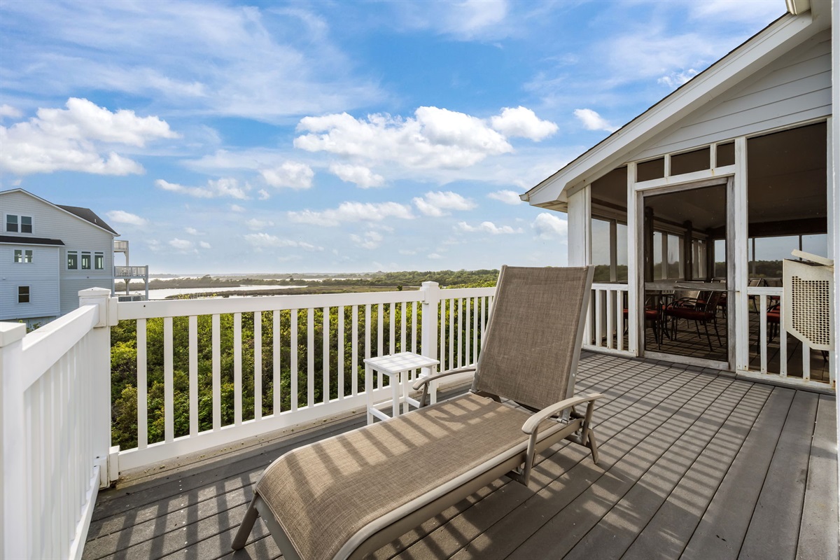 Private balcony with lounge seating&mdash;perfect for soaking in expansive sound views and coastal breezes