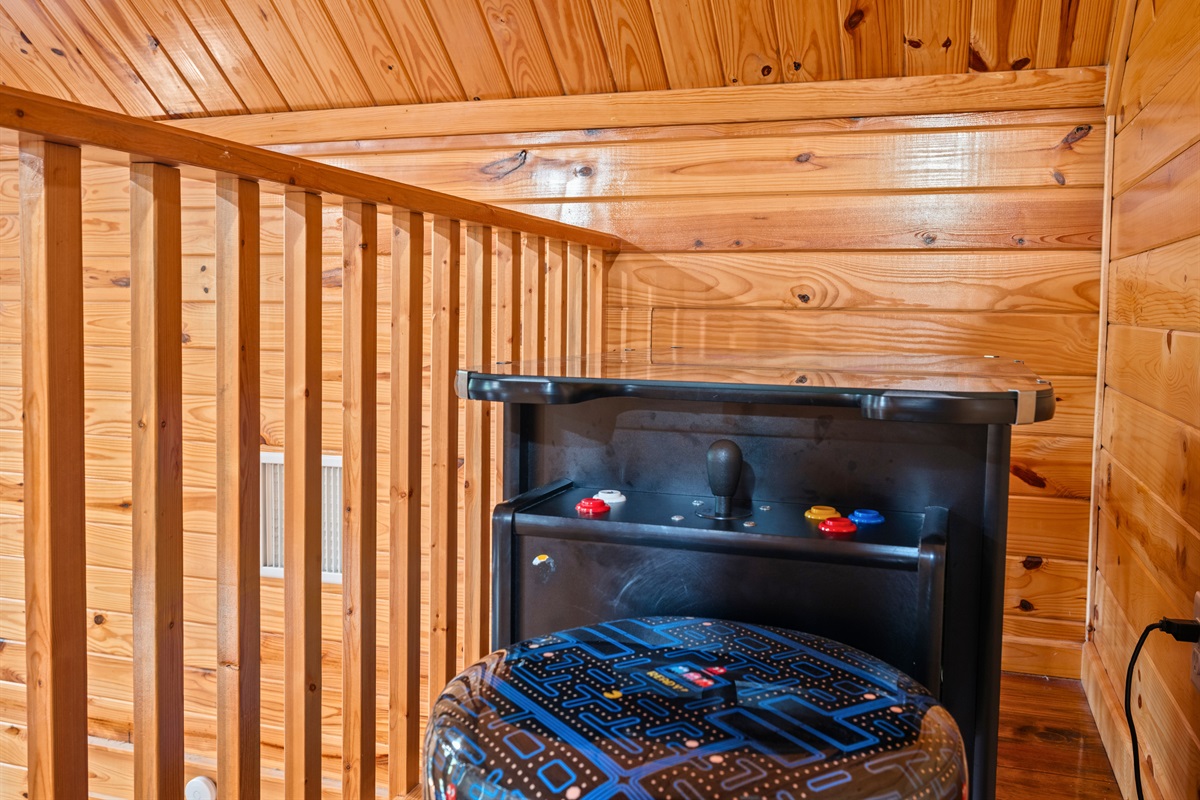 Tucked into its own corner, the arcade table adds a fun element and gives guests a place to enjoy a little indoor entertainment.