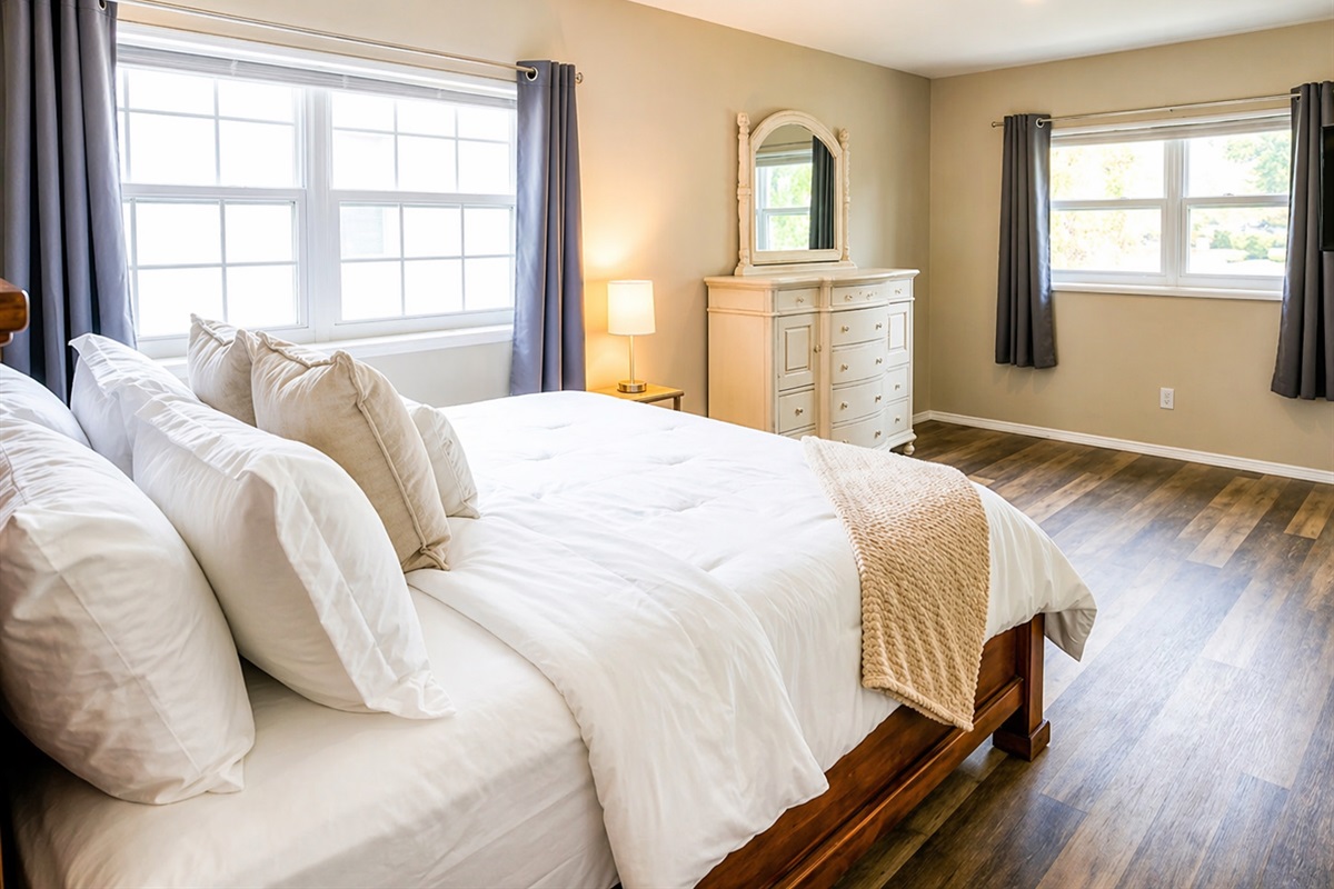 Bedroom 1 - Bright and airy master bedroom with multiple windows and attached ensuite