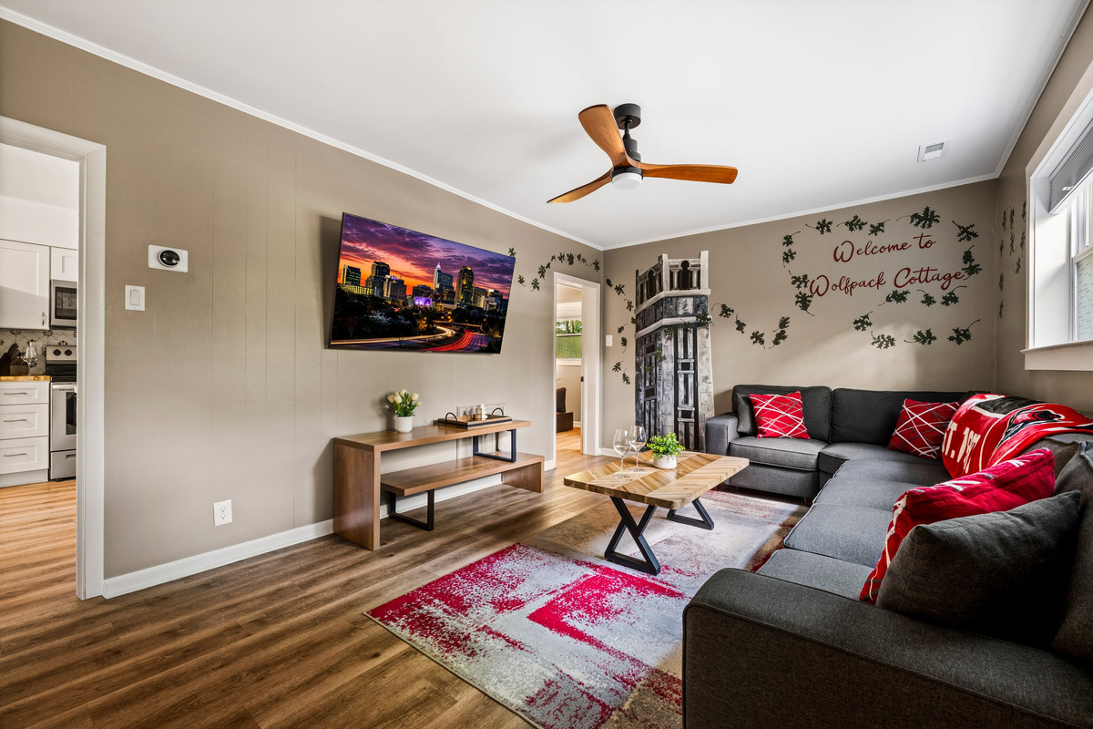 The Wolfpack living room celebrates NC State traditions with custom artwork and local touches.