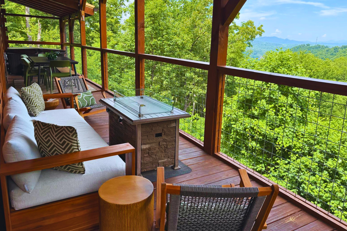 Enjoy the comfortable outdoor setting in the main deck with hot tub, dining table, seating area around the fire pit, Weber propane grill and outdoor games, perfect for outdoor entertainment