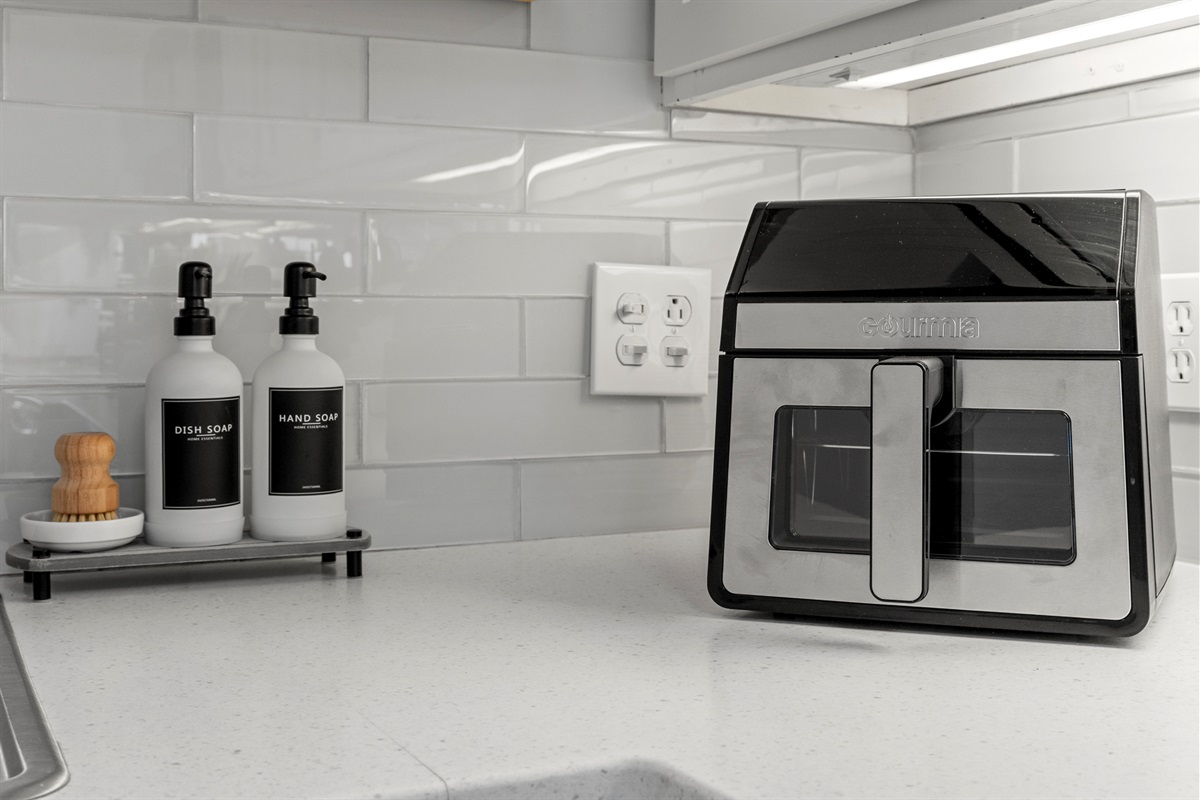 Guest-ready with sleek countertop essentials, offering both function and style for your daily routines.