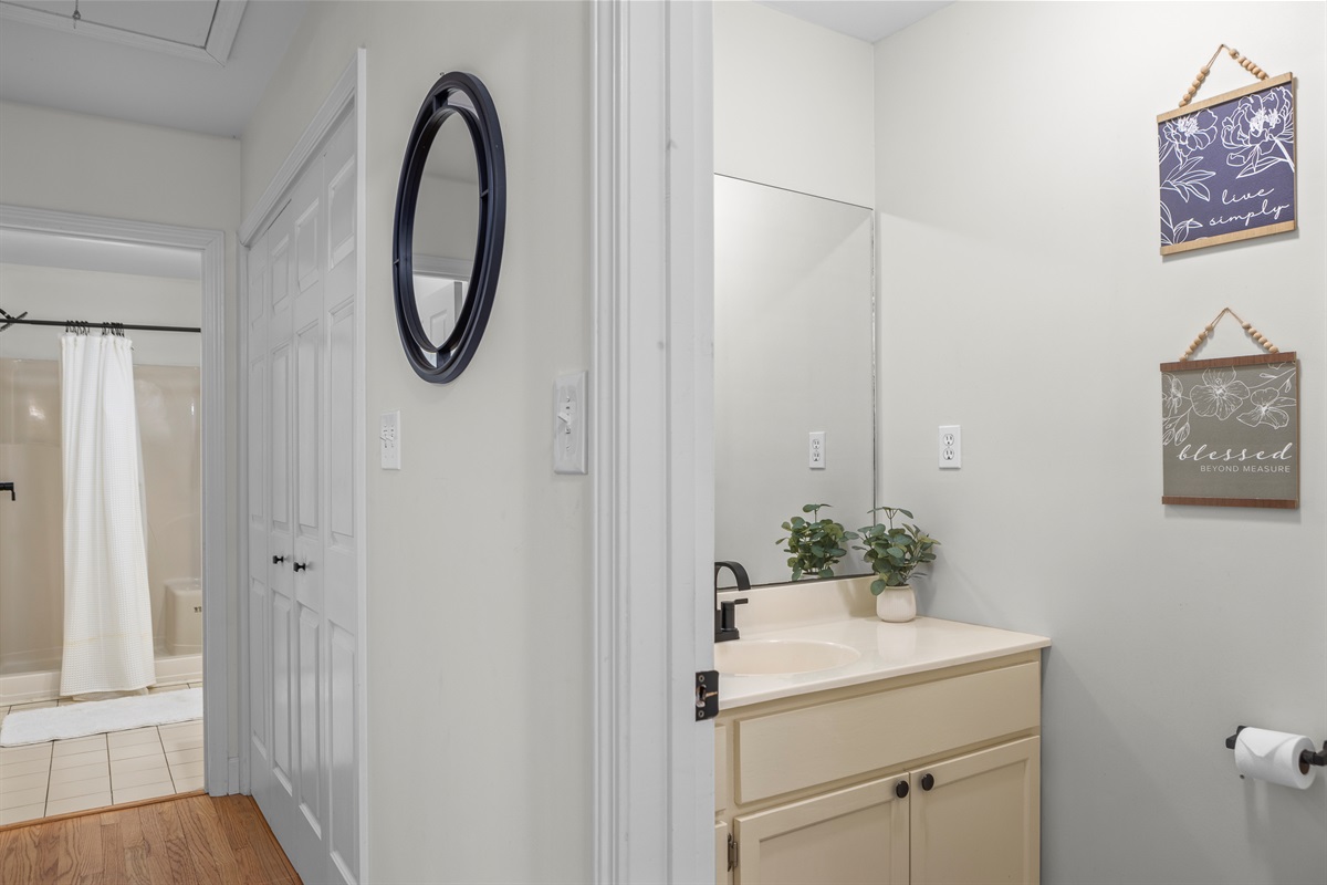 Half Bathroom 2: Bright space with modern fixtures and uplifting decor for refreshing moments!