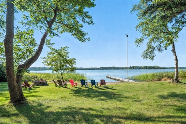Private dock and sandy beach for swimming, fishing, and sitting by the fire pit at night