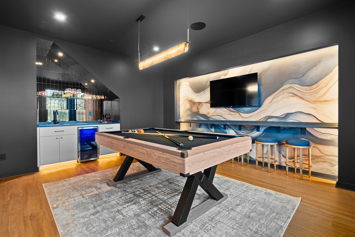 A closer look at the pool table area shows off just how much space you have to spread out, play a few rounds, and enjoy a relaxed game-night vibe.