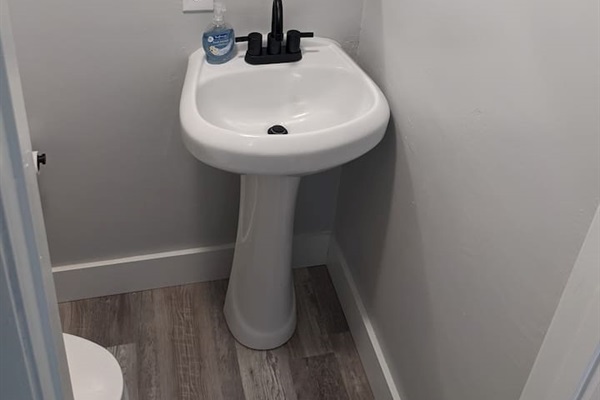 Powder room downstairs to the right of the front door