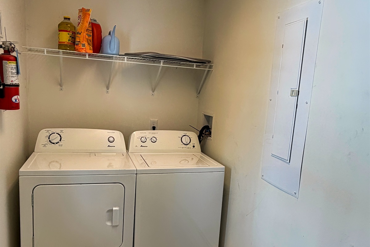 Laundry room with washer dryer.