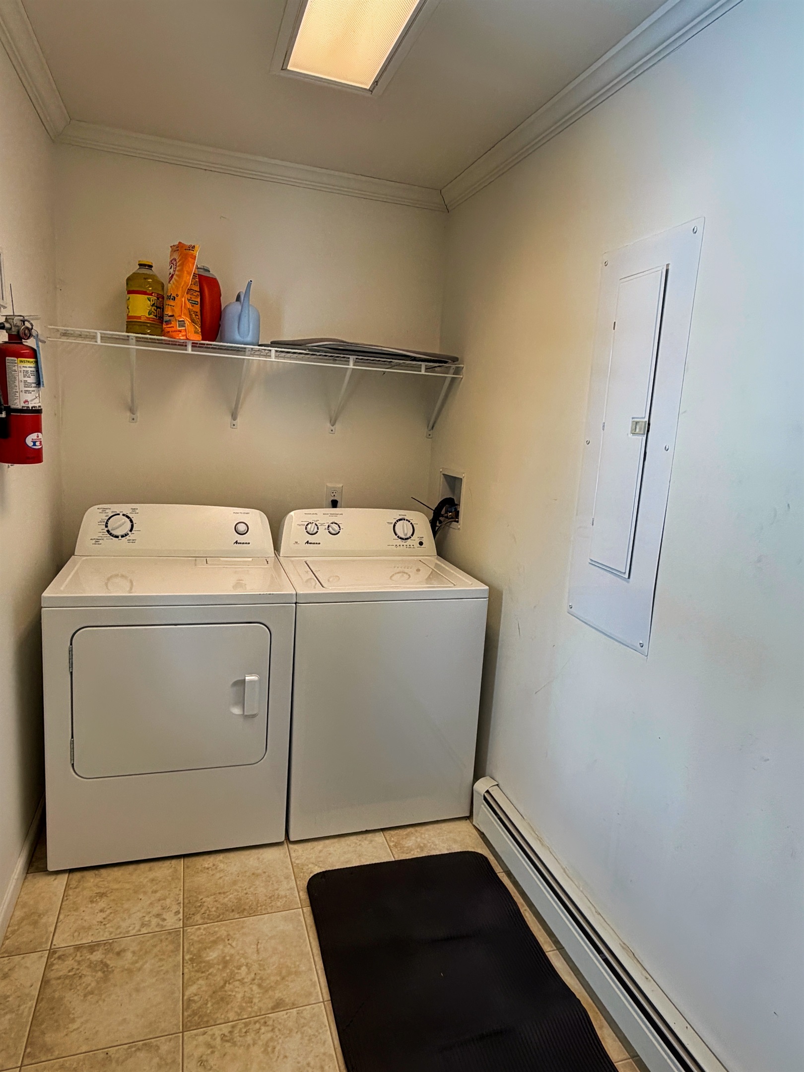 Laundry room with washer dryer.