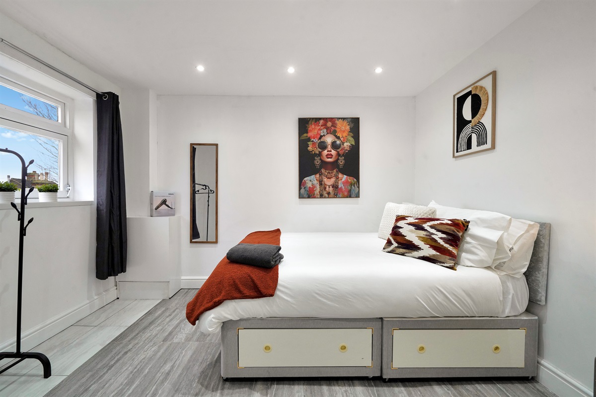 [king bed, blackout curtains, storage space]