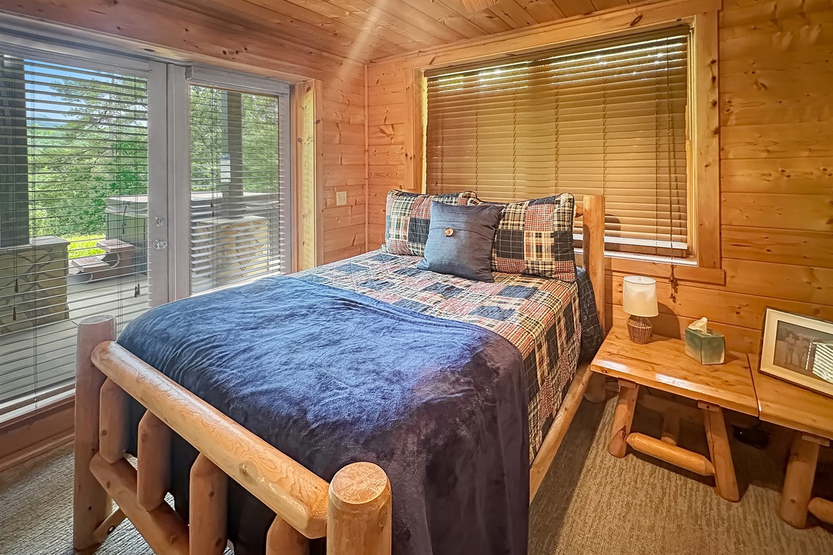 Enjoy restful nights in a charming log bedroom with nature views!