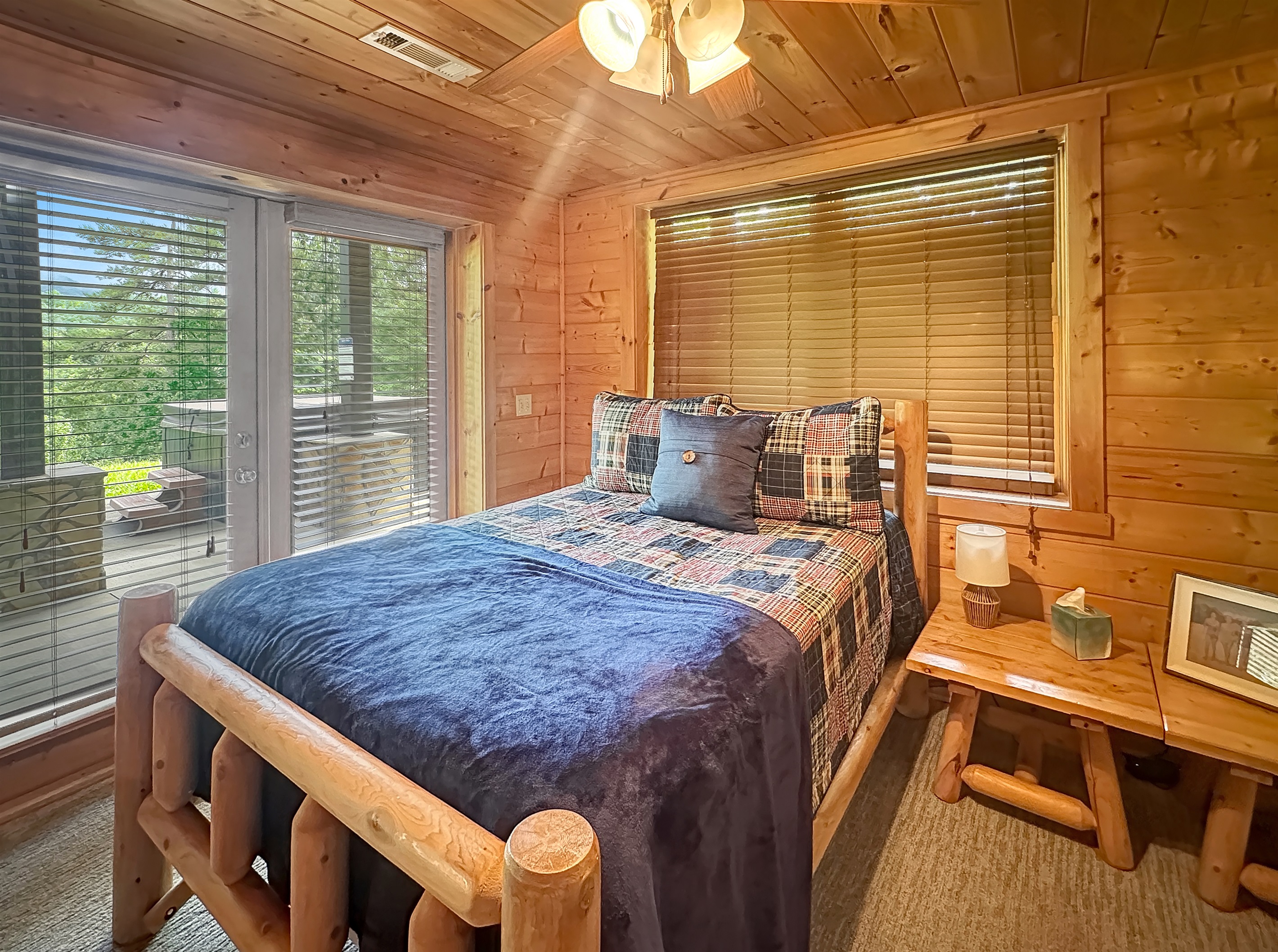 Enjoy restful nights in a charming log bedroom with nature views!