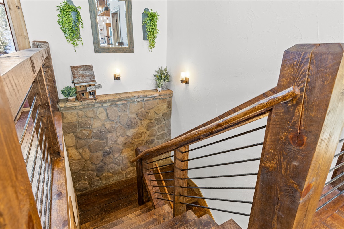Rustic elegance meets thoughtful design &mdash; this beautifully crafted staircase is just one of the charming details that make this mountain cabin feel like home.