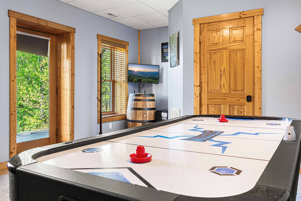 Our game room with air hockey, 2 player barrel arcade, board games, card games & puzzles offers hours of entertainment.