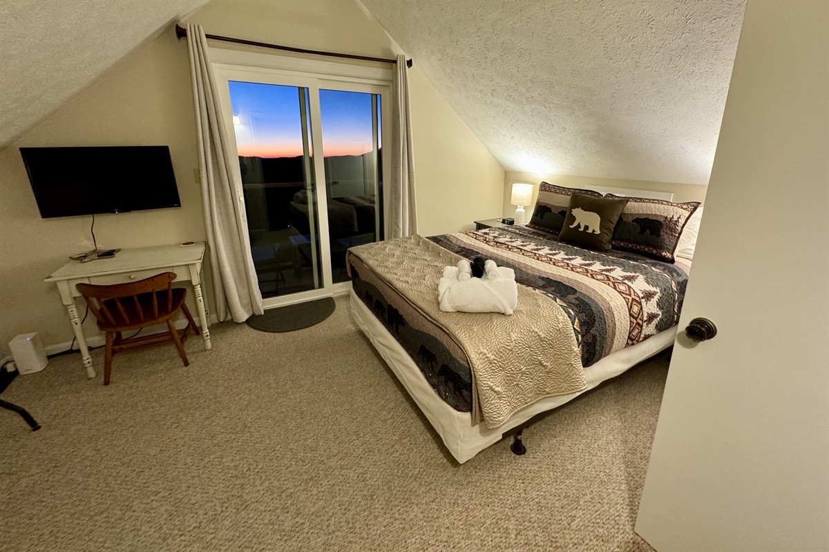 Our Top Floor Queen View Bedroom has a private balcony with sliding door to enjoy the mountain & valley views - the reason you stay in Seven Devils - high above it all! It also has a Desk, Chair, Roku Smart TV, & Twin Futon. Be nice & share that view!
