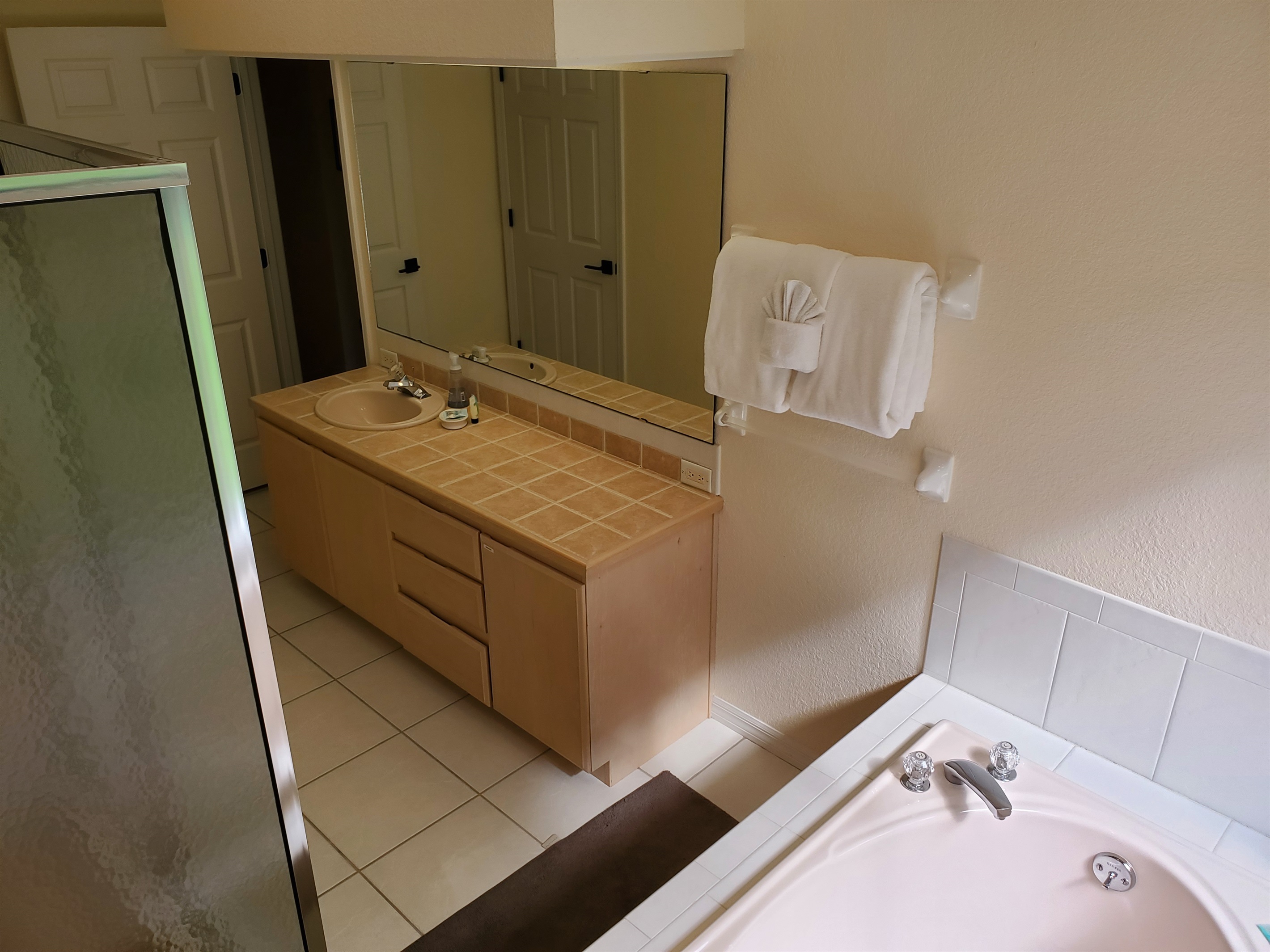 Master King private bathroom with walk in shower and sunk-in tub