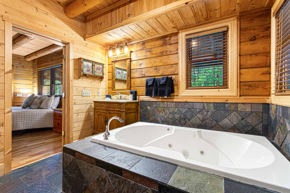Main Level Master Bathroom: Indulge in relaxing soaks surrounded by rustic charm and modern comfort!