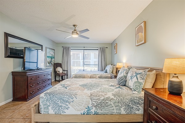 Bedroom with two queens, smart TV, ceiling fan and ensuite bathroom