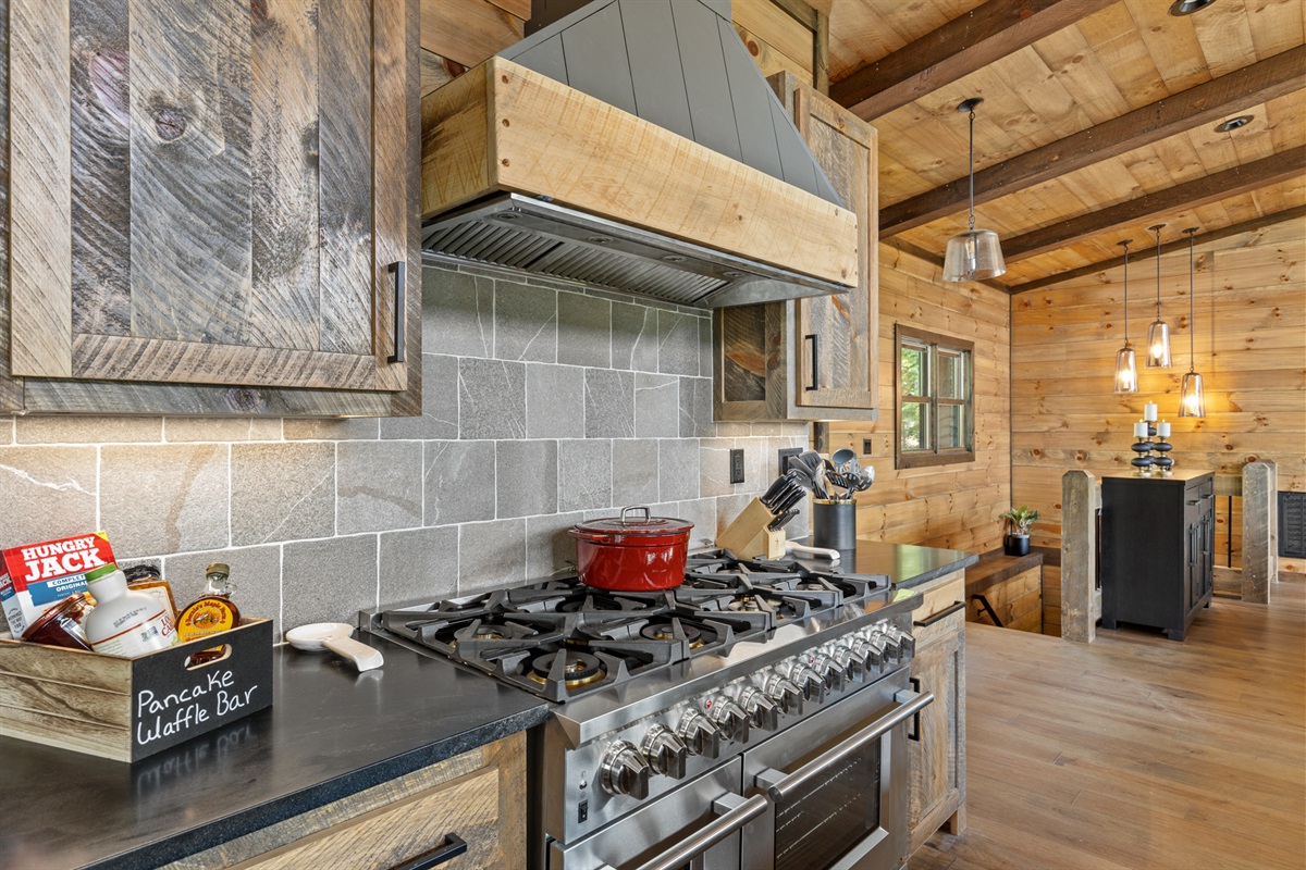 The kitchen featuring an 8 gas stove top