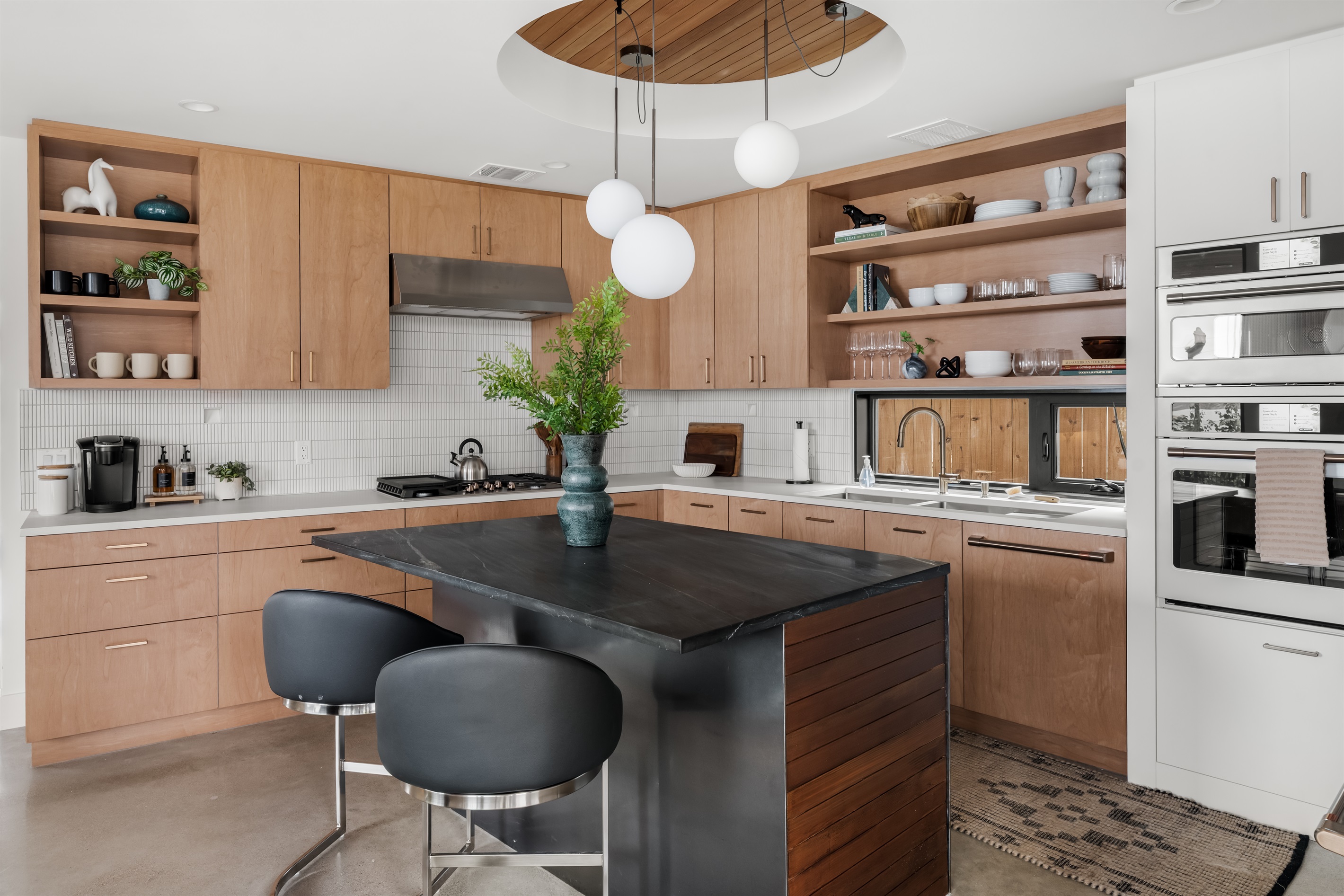Spacious kitchen island with bar seating—ideal for casual breakfasts, prep space, or gathering with friends.