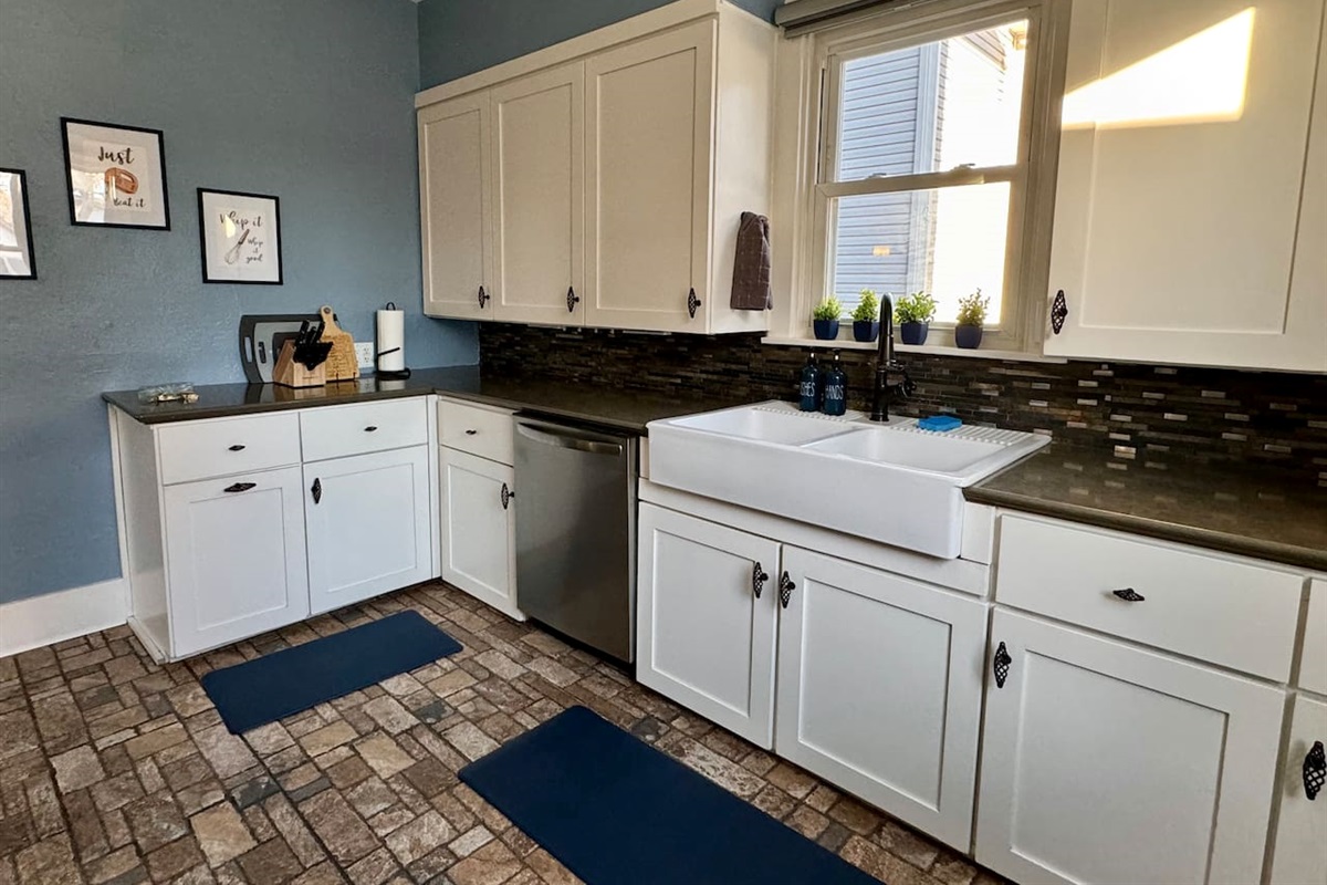 You'll find plenty of dishes, silverware, coffee cups, glasses, wine glasses and more for your group.