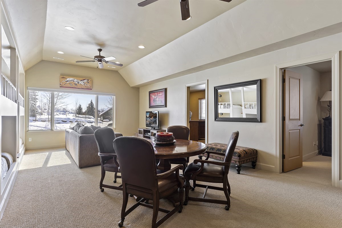 Comfortable family room with plenty of seating and natural light—ideal for relaxing together after a day of adventure.