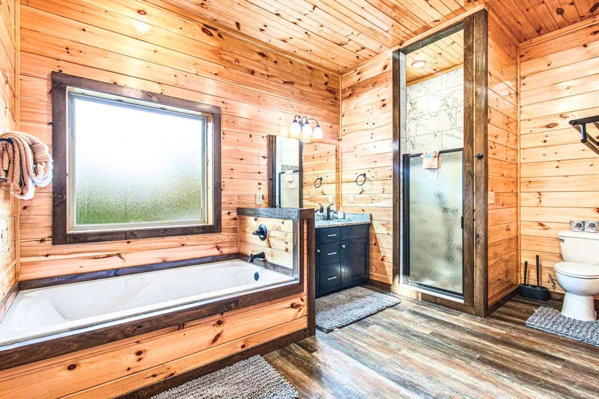 Ensuite Bathroom with Deep Soaking Tub, Walk in Shower and Bright Lighting