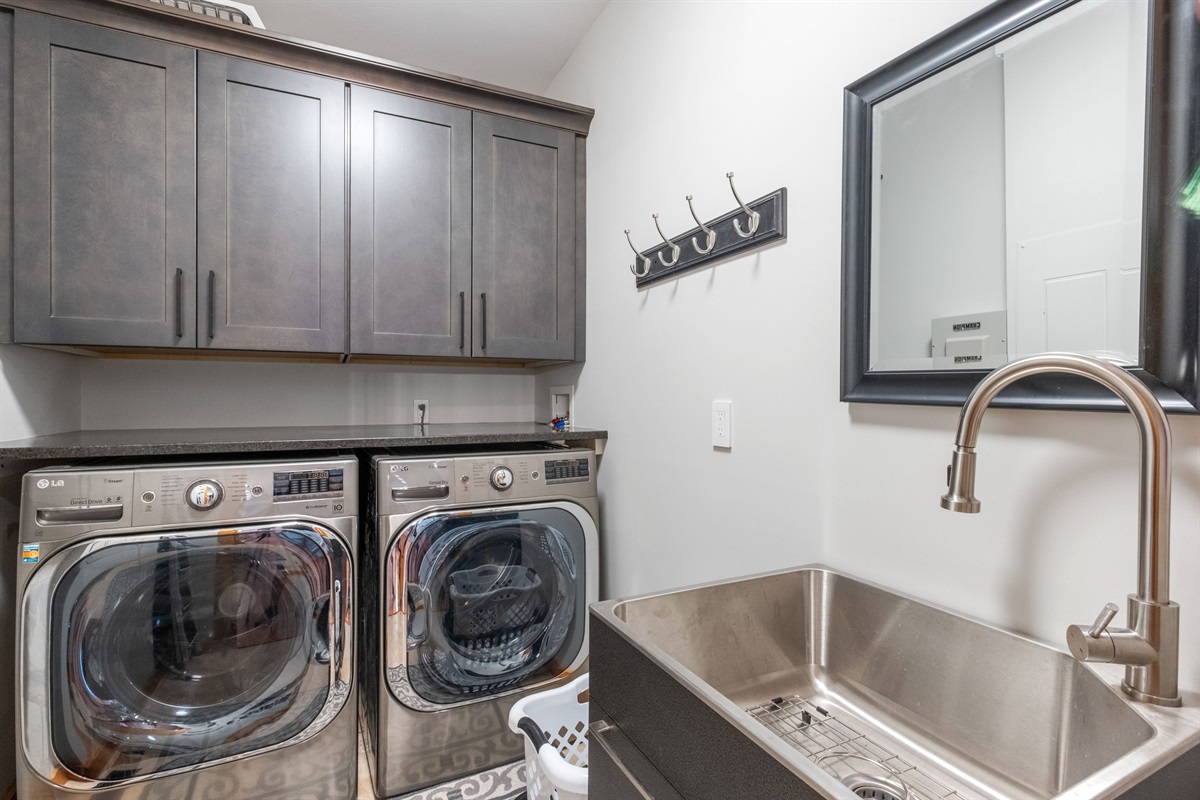 Laundry room with washer, dryer and its own sink