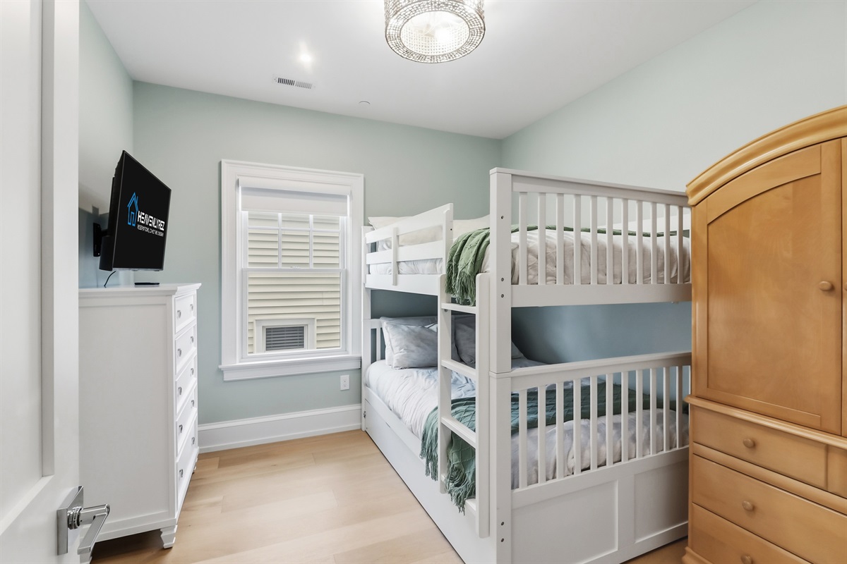 Full over full bunk bed with a twin trundle