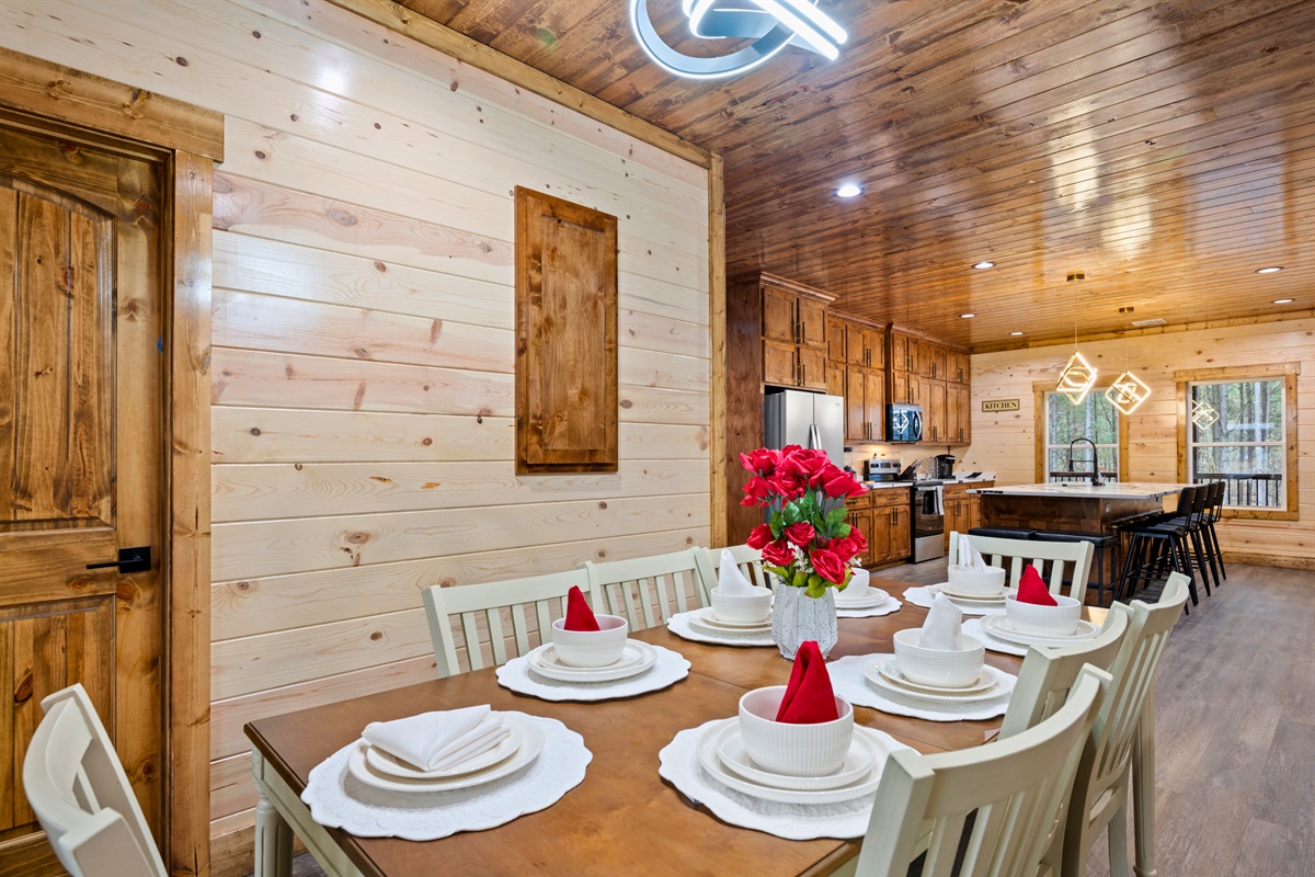 A closer look at the dining area shows a welcoming space where everyone can gather comfortably around the table.