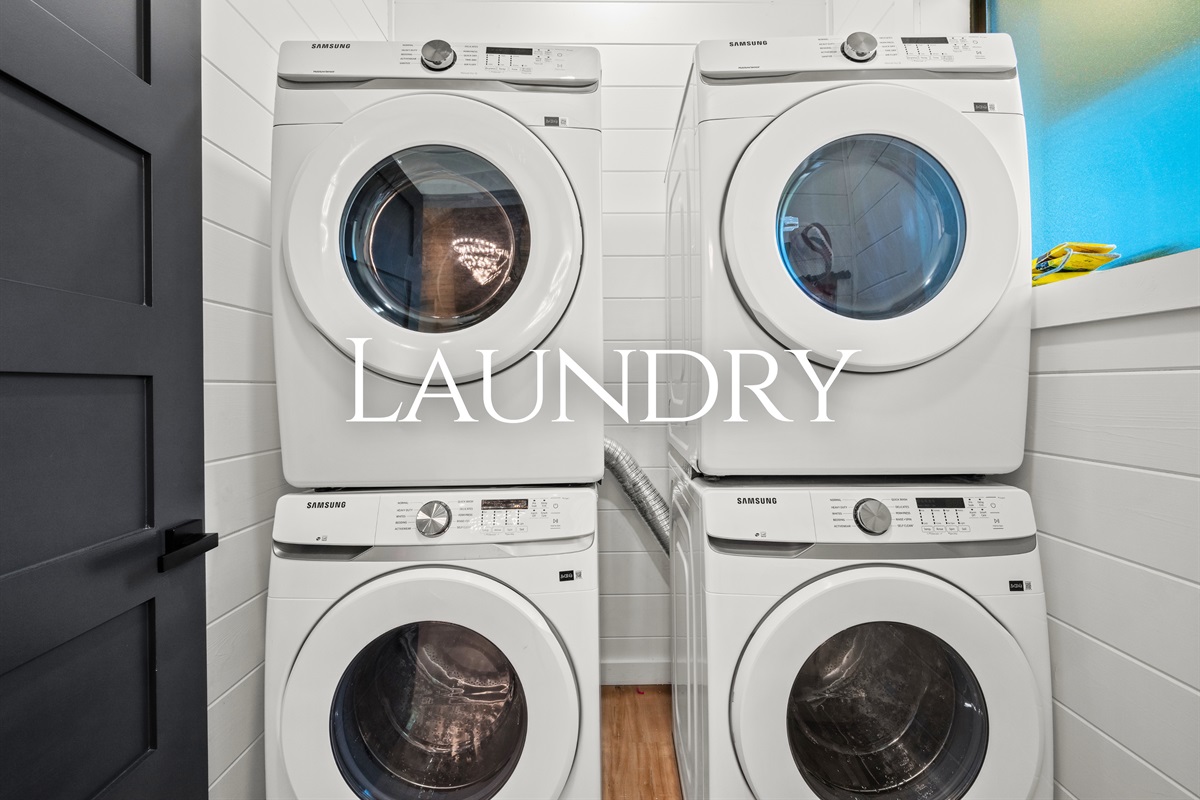 The laundry area includes full-size washer and dryer units, making it easy to keep up with towels, swimsuits, and clothes during your stay.