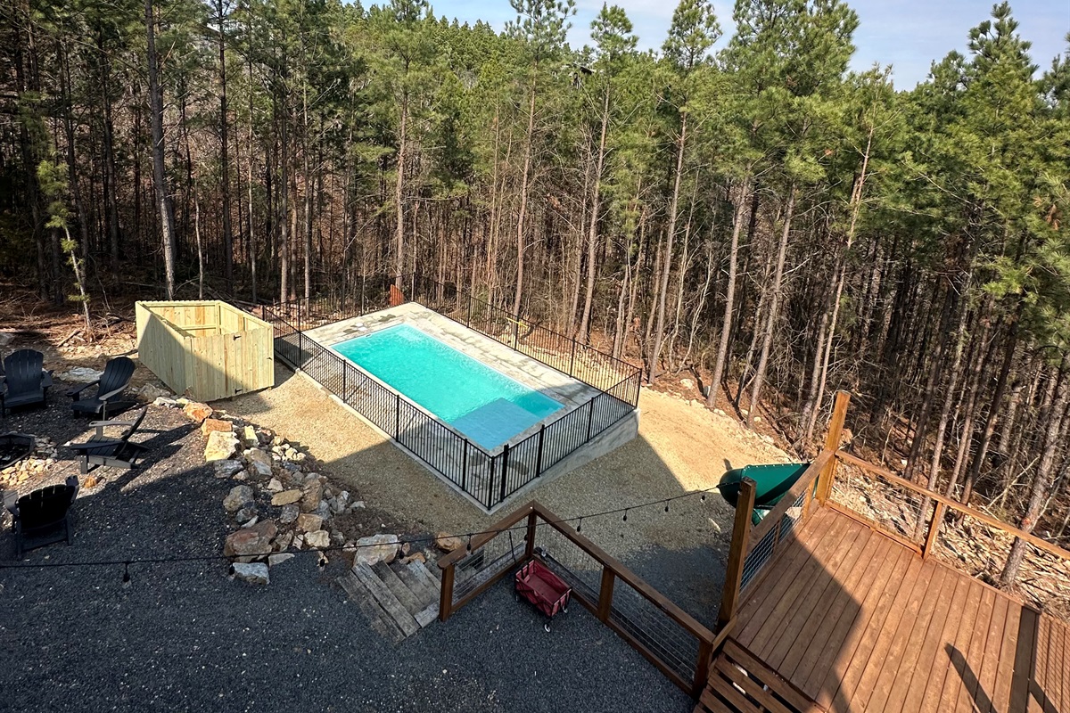 step into tranquility — a secluded pool setting where luxury meets the natural beauty of hochatown.