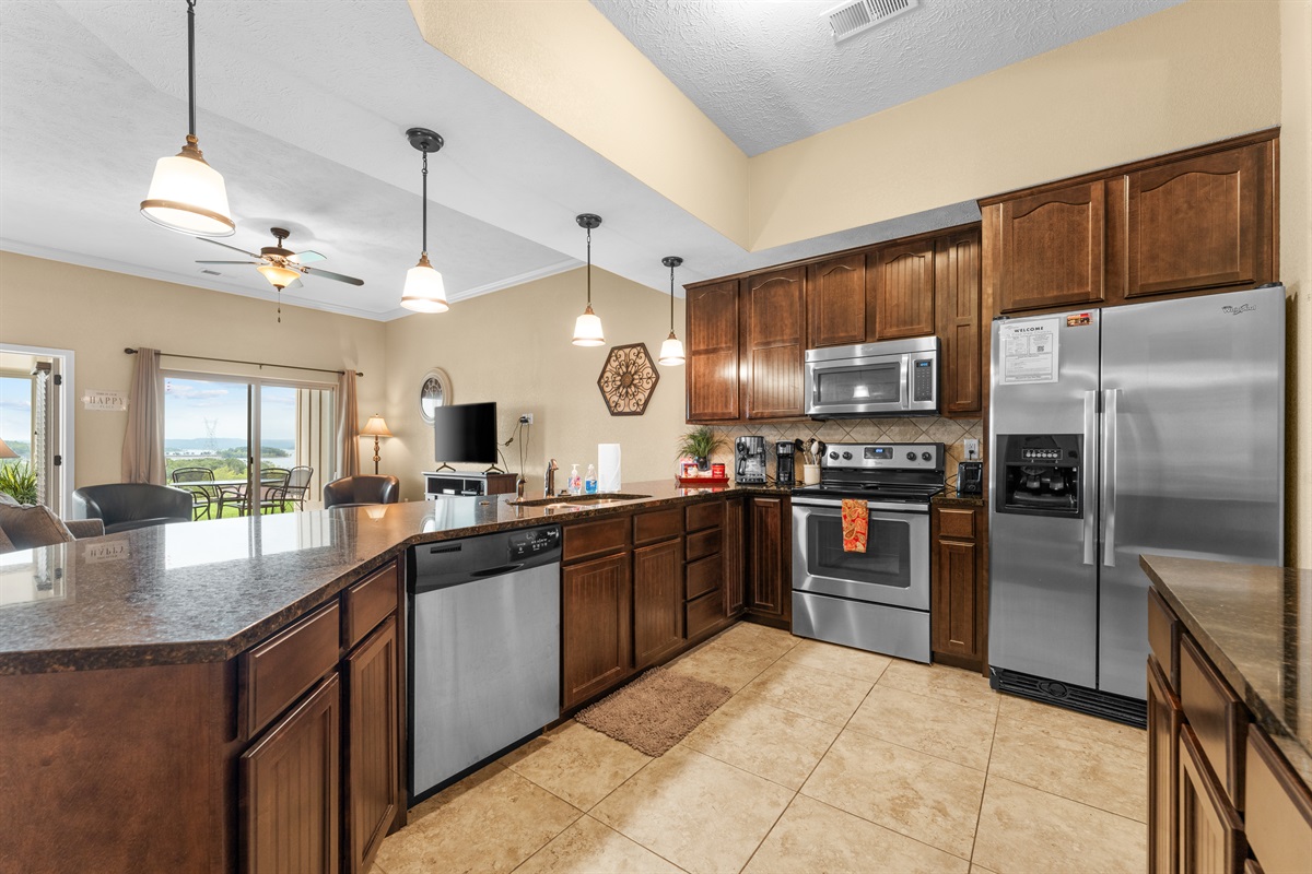 Granite counters, full-size appliances, and generous prep space make staying in feel effortless.