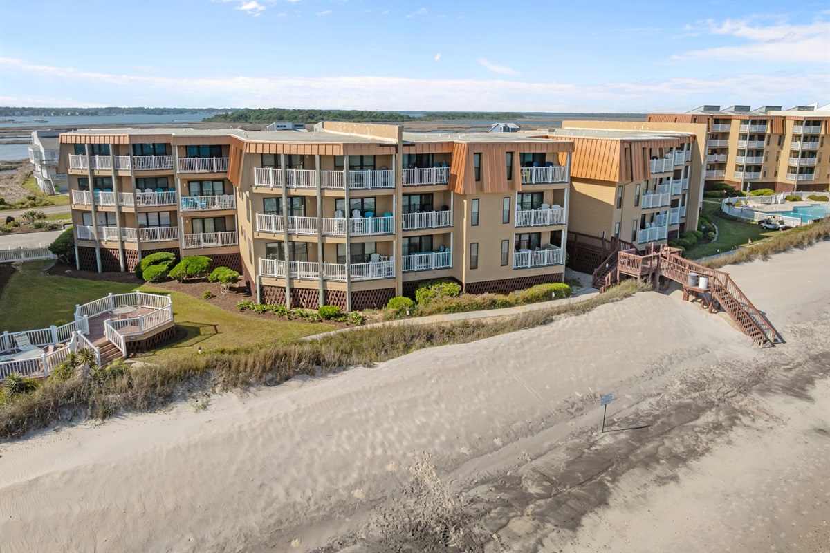 Elevated dunes and private beach access leading straight to the shoreline