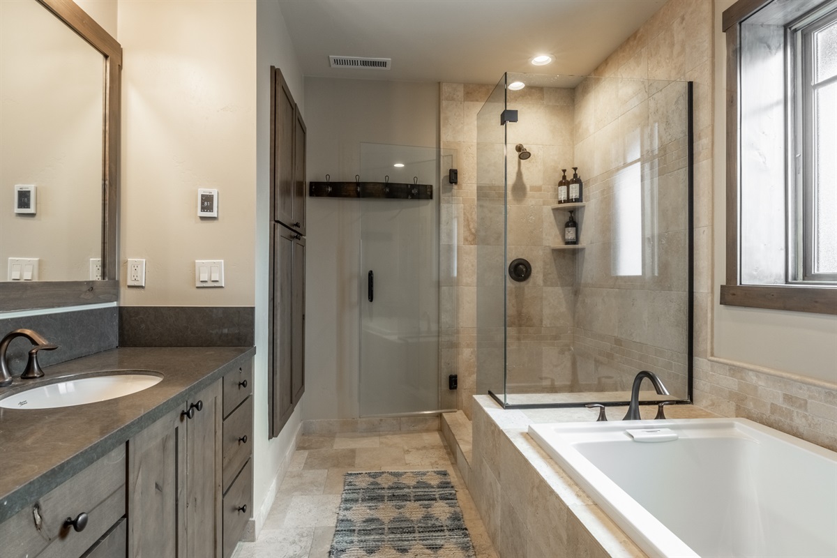 Heated floors, soaking tub, walk-in shower, and double vanity—designed for spa-level comfort after a day on the mountain.