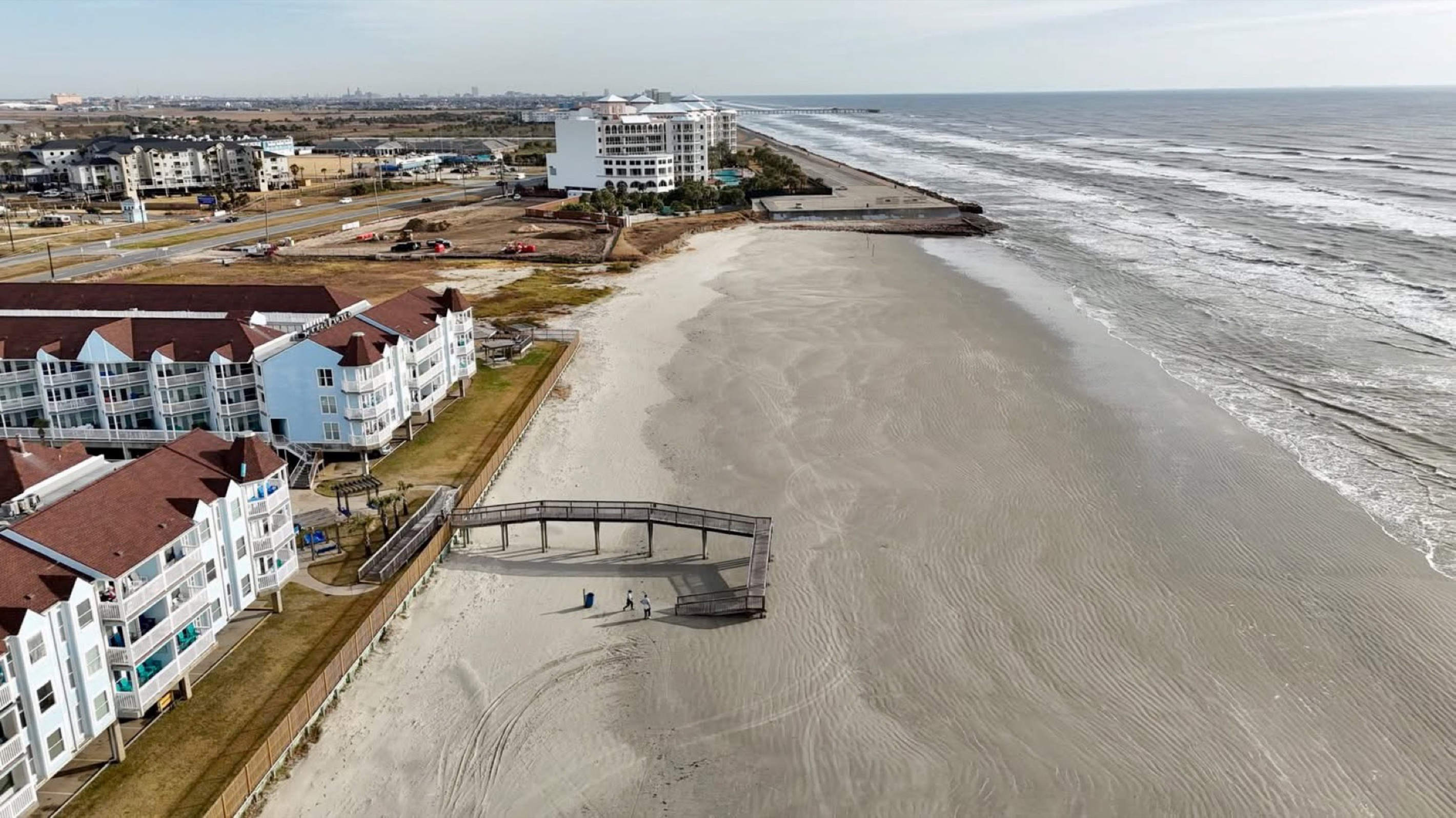Another view of paradise—private balconies, heated pools, and unbeatable beachfront access from every angle.