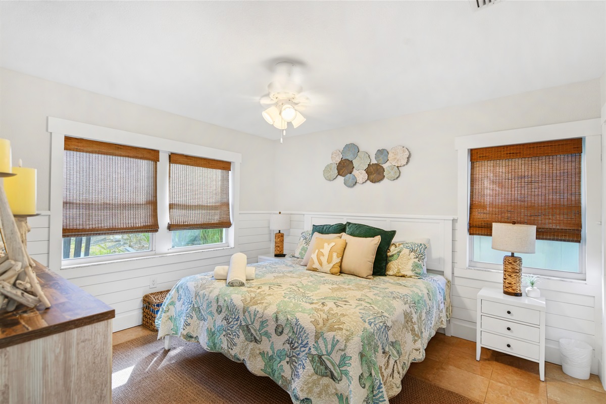 Bedroom three offers a king bed, smart TV and adjacent bathroom.